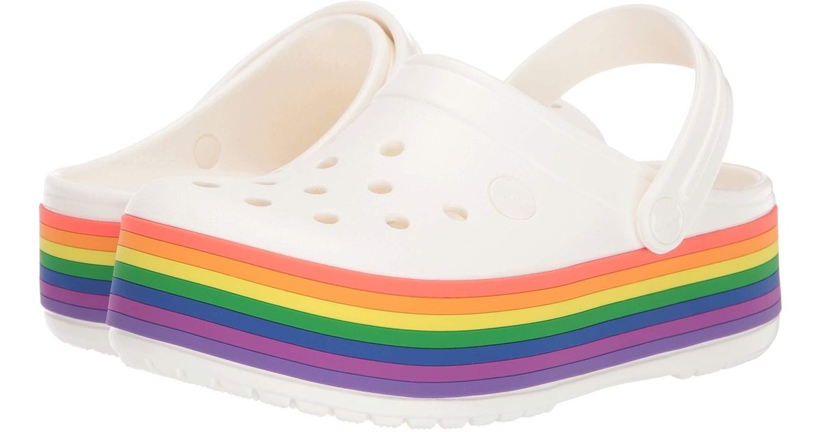 white and rainbow crocs
