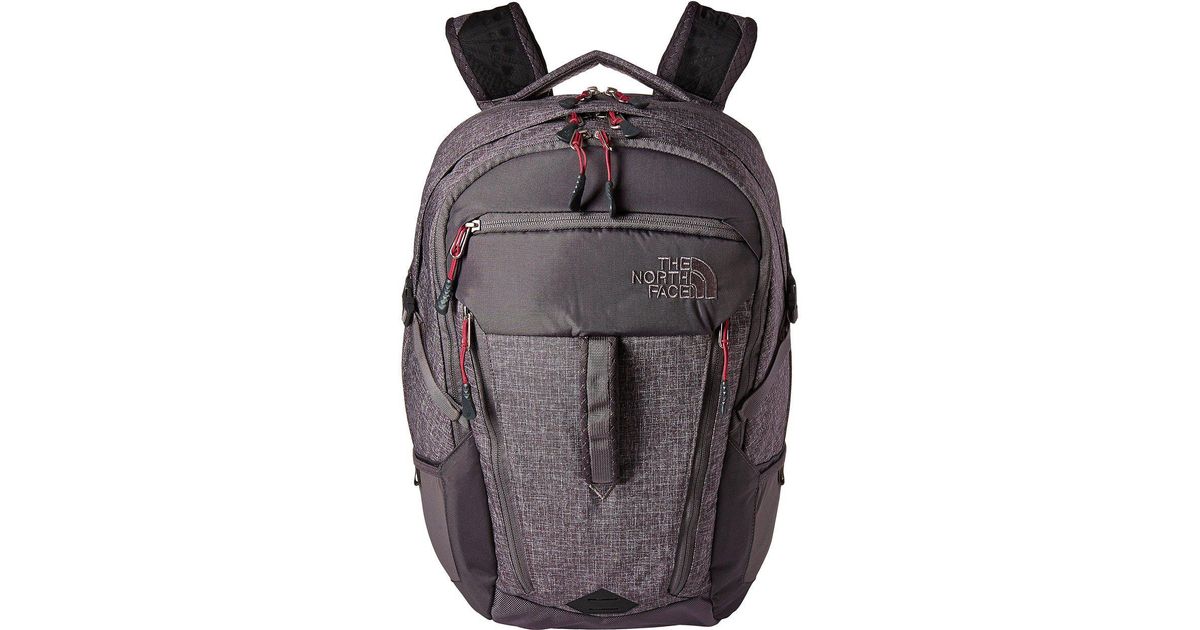 gray and pink north face backpack