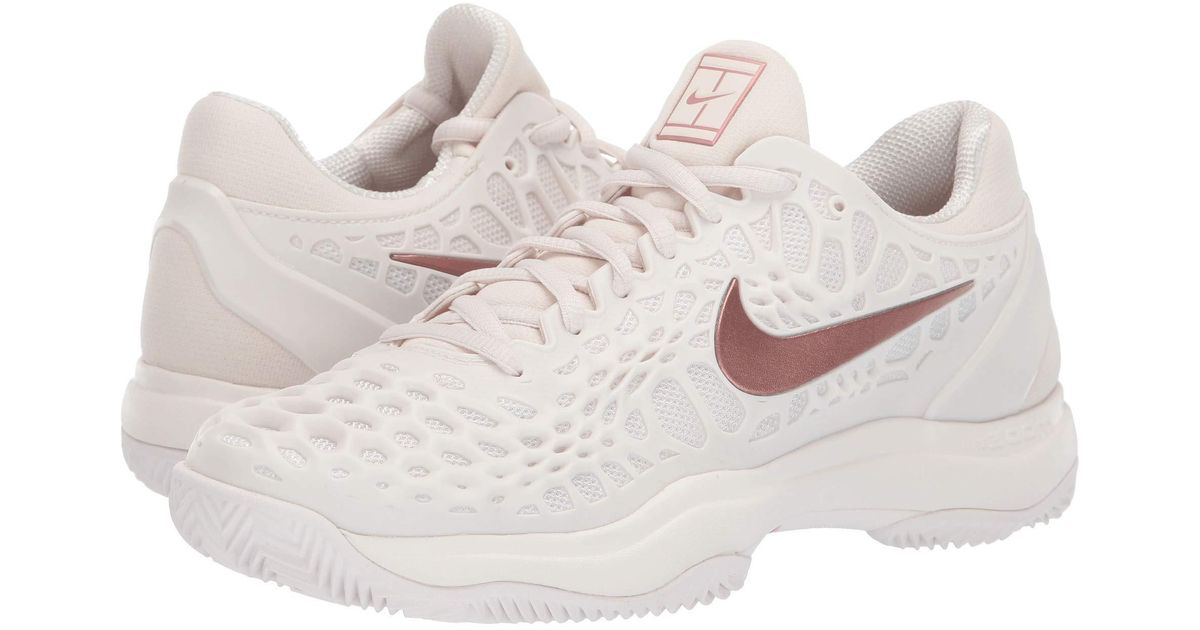 rose gold nike tennis shoes