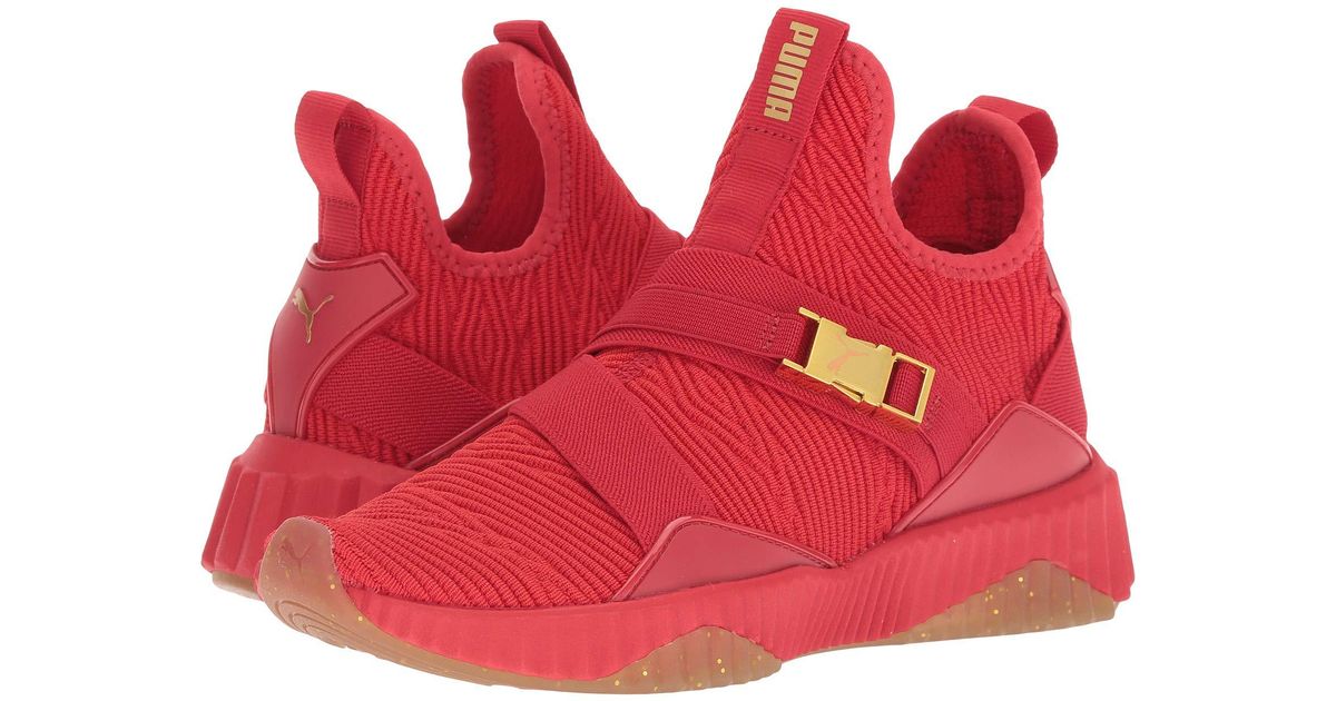 puma defy mid red