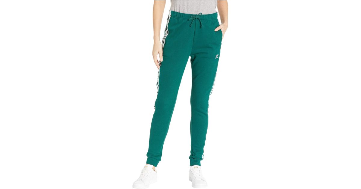 collegiate green adidas track pants