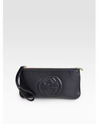 black gucci wristlet