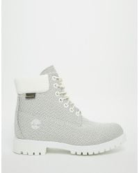 gray and white timbs