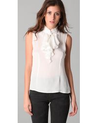 tucker ruffle sleeveless blouse ivory