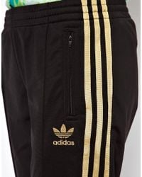 adidas pants black and gold