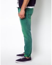 green slim jeans