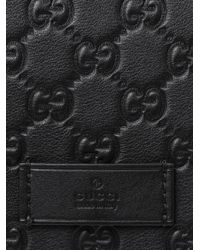 black gucci embossed bag