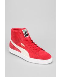 red suede pumas high top