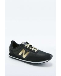 new balance black and gold trainers