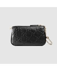 black gucci key pouch