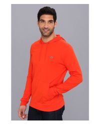 orange lacoste sweatsuit