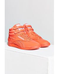 orange reebok sneakers