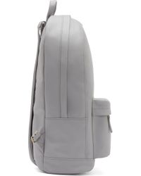 light grey leather backpack