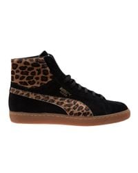 leopard and black trainers