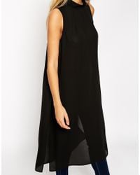 black sleeveless tunic top