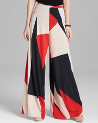 Alice + Olivia Alice Olivia Pants Super Flare Wide Leg in Red - Lyst