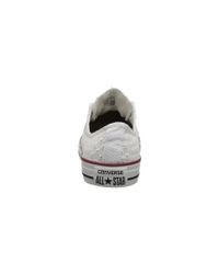 white eyelet converse sneakers