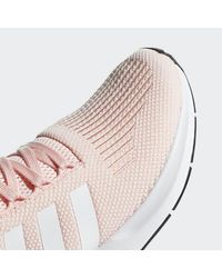 pink adidas swift run