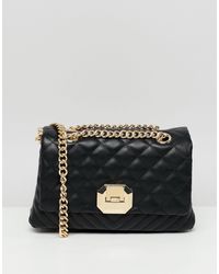 bandolera negra acolchada