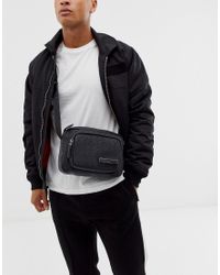 Bandolera negra con monograma Industrial Calvin Klein de Denim de color  Negro para hombre | Lyst