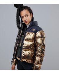 metallic gold north face jacket