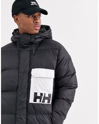 Plumífero negro P\u0026C Helly Hansen de hombre de color Negro | Lyst