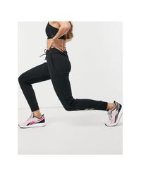 Reebok Track pants and sweatpants for Women - Up to 56% off at Lyst.ca