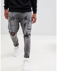 Jeans nero slavato strappati con cavallo basso e tasche cargoASOS in Denim  da Uomo colore Nero | Lyst