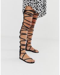 black thigh high gladiator sandals