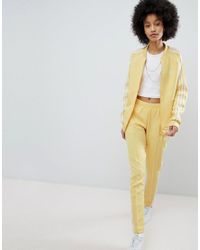 yellow adidas pants womens