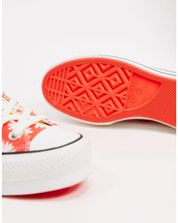 Chuck Taylor - Baskets montantes à imprimé pâquerettes avec ... Chuck Taylor - Baskets montantes à imprimé pâquerettes avec ...
