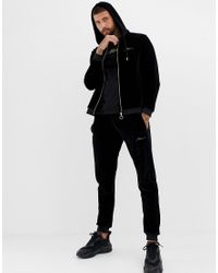 Tuta in velour nera con ricami oroBoohooMAN in Denim da Uomo colore Nero |  Lyst