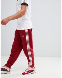 adidas Adicolor - Joggingbroek Met 3 Strepen In Rood Cw2428 in het Rood  voor heren - Lyst