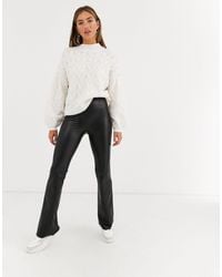 black faux leather flare pants