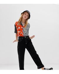 black women's jeans with white stitching