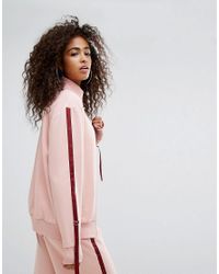 Top de survêtement avec liens à tirer sur les côtés Ellesse en coloris Pink