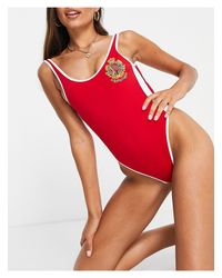 Guess Monokinis and one-piece swimsuits Women Up to 55% off at Lyst.com