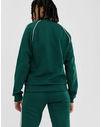 adidas originals adicolor three stripe track jacket in green