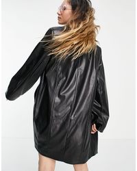 collusion unisex oversized pu shirt in black