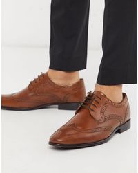 Veterschoen in donkerbruin suède met brogue decoratie van Van Bommel