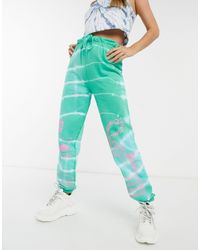 New Girl Order – legere jogginghose mit drachen-motiv und batikmuster,  kombiteil in Grün - Lyst