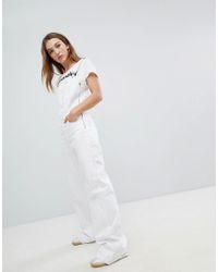 white flared dungarees