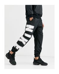Nike Synthetik – Jogginghose mit engen Bündchen und Logo in Schwarz für  Herren - Lyst