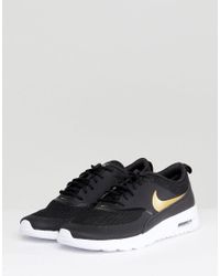 Air Max Thea Trainers In Black And Gold 