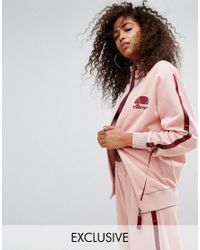 Top de survêtement avec liens à tirer sur les côtés Ellesse en coloris Pink