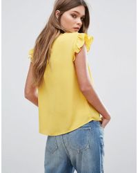 yellow flutter sleeve top
