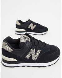 new balance 574 animal print sneakers in gray