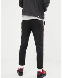 Pantaloni neri con riga laterale rossa e biancaPull\u0026Bear in Denim da Uomo  colore Nero | Lyst
