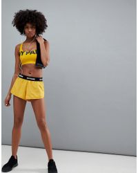 ivy park orange shorts