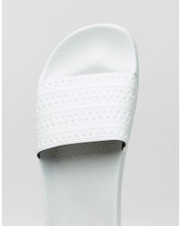 mint green adidas sliders